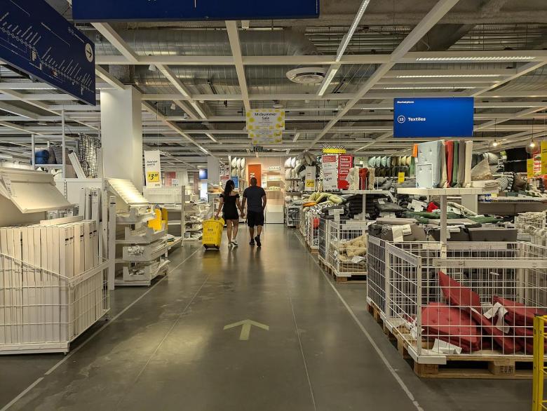 A couple walks through the textiles department of the IKEA in Burbank, California on July 7, 2024.