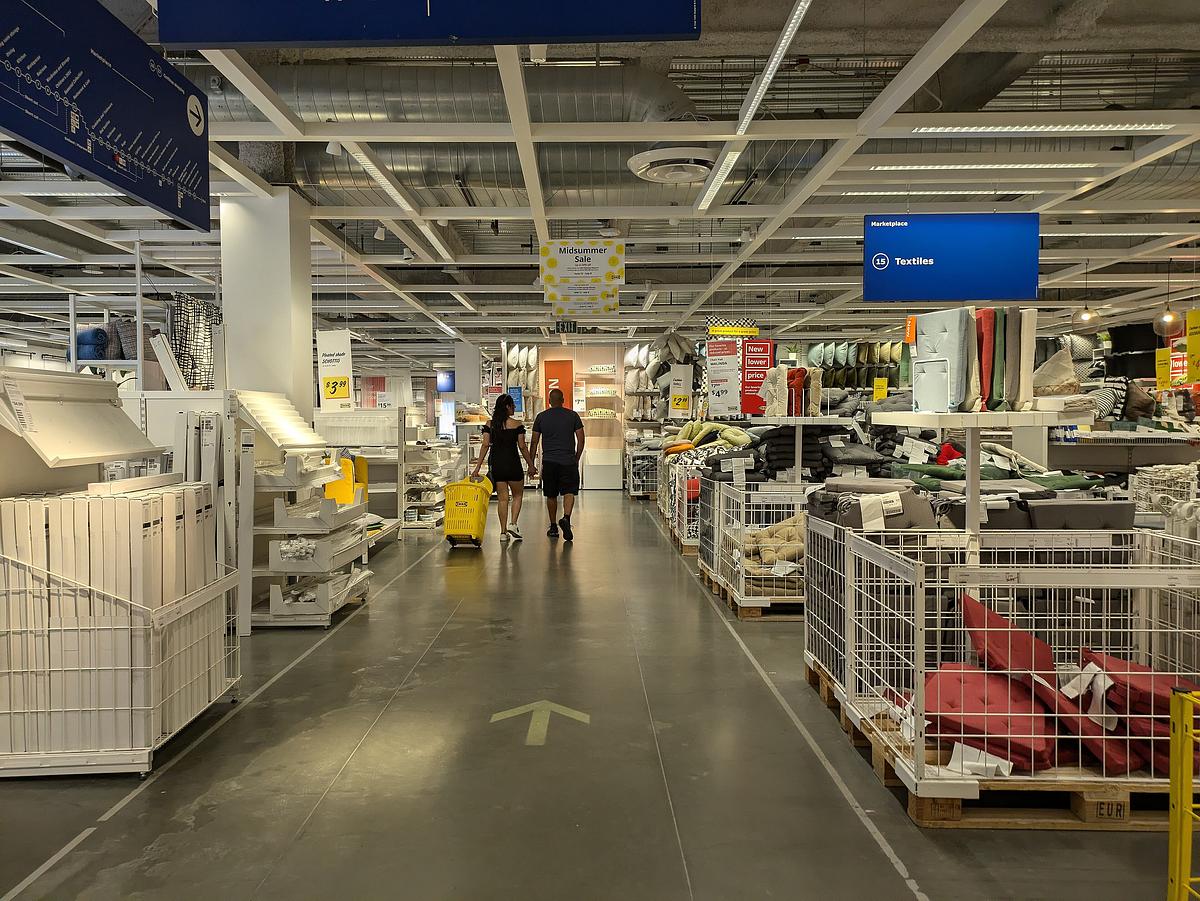 A couple walks through the textiles department of the IKEA in Burbank, California on July 7, 2024.
