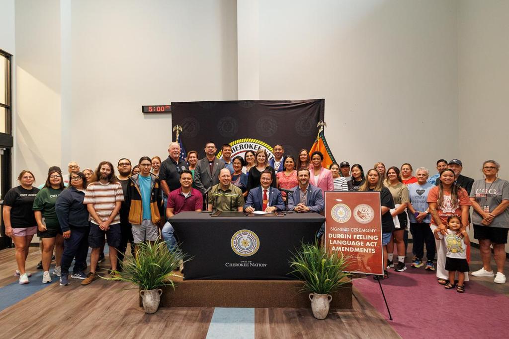 Cherokee Nation Principal Chief Chuck Hoskin Jr. and other Cherokee Nation leaders join the tribe’s language department to sign an amended Durbin Feeling Language Preservation Act on June 25, 2026. The amendment to this existing law replaces the tribe’s language immersion state charter board with tribal government oversight.