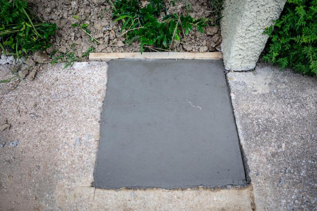 A fiilled in bust out is photographed at the Heights apartments is photographed on Tuesday, July 14, 2026. These holes are used to get under the ground to fix foundations due to soil erosion.