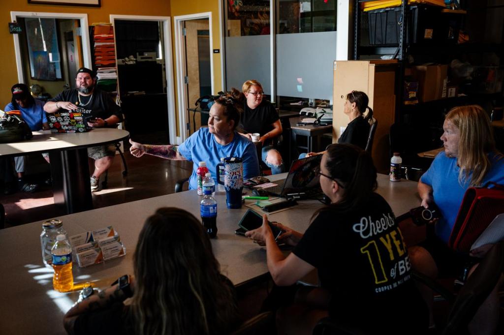 Tara Rubio, program coordinator at ourtreach services for the day center, center, leads the team's morning meeting before heading out to do outreach work on Tuesday, July 21, 2026.