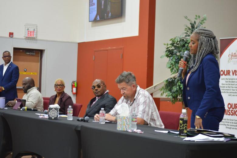 Candidates for Tulsa City Council's District 1 seat look on as incumbent Vanessa Hall-Harper speaks during a forum at Antioch Baptist Church on July 22, 2026.