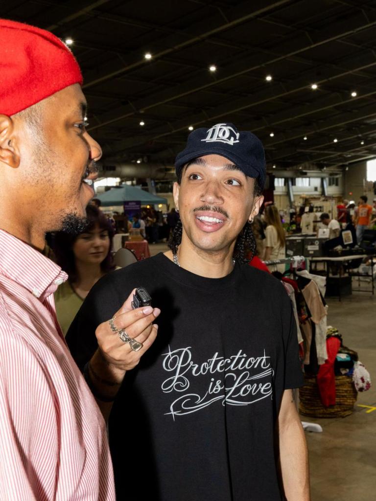 Vame interviews a shopper at the annual Time Travelers Vintage Expo on June 20, 2026.