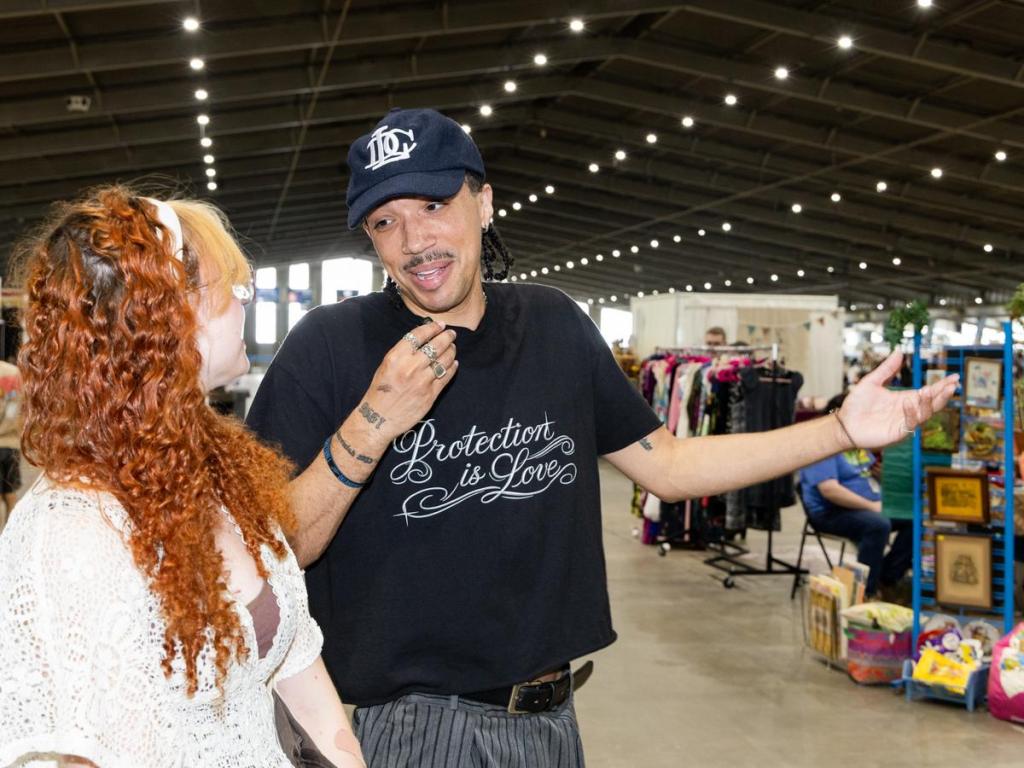  Vame interviews a shopper at the annual Time Travelers Vintage Expo on June 20, 2026.