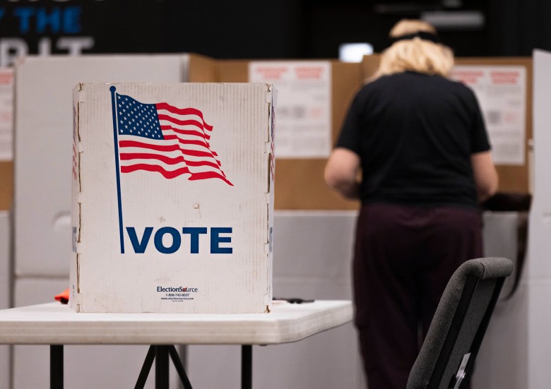 Voters fill out and cast their ballots at Broken Arrow's Aspen Creek Church polling station, April 7, 2026.