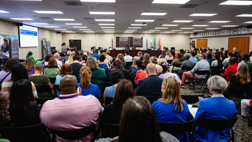 Community members pack a Sept. 21, 2026, Tulsa Public Schools board meeting to hear about proposed campus closures.