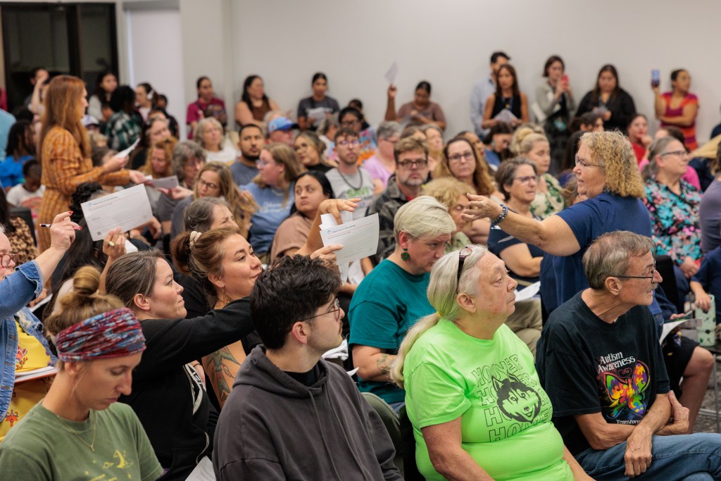 people in audience at library