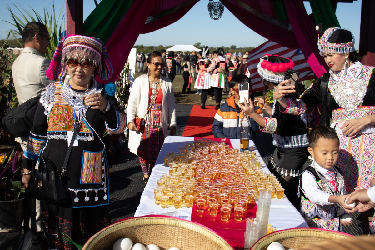 People enter the annual Hmong New Year celebration in Inola, Oklahoma, Saturday, Oct. 17, 2026. You take a shot of sparkling juice and an egg to replenish your spirits and welcome in the new year. Credit: Libby Hobbs / Tulsa Flyer