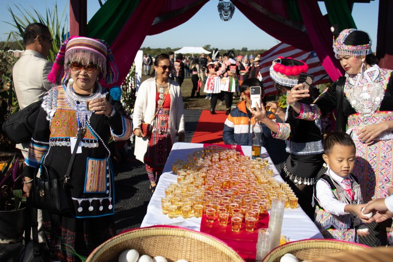 People enter the annual Hmong New Year celebration in Inola, Oklahoma, Saturday, Oct. 17, 2026. You take a shot of sparkling juice and an egg to replenish your spirits and welcome in the new year. Credit: Libby Hobbs / Tulsa Flyer