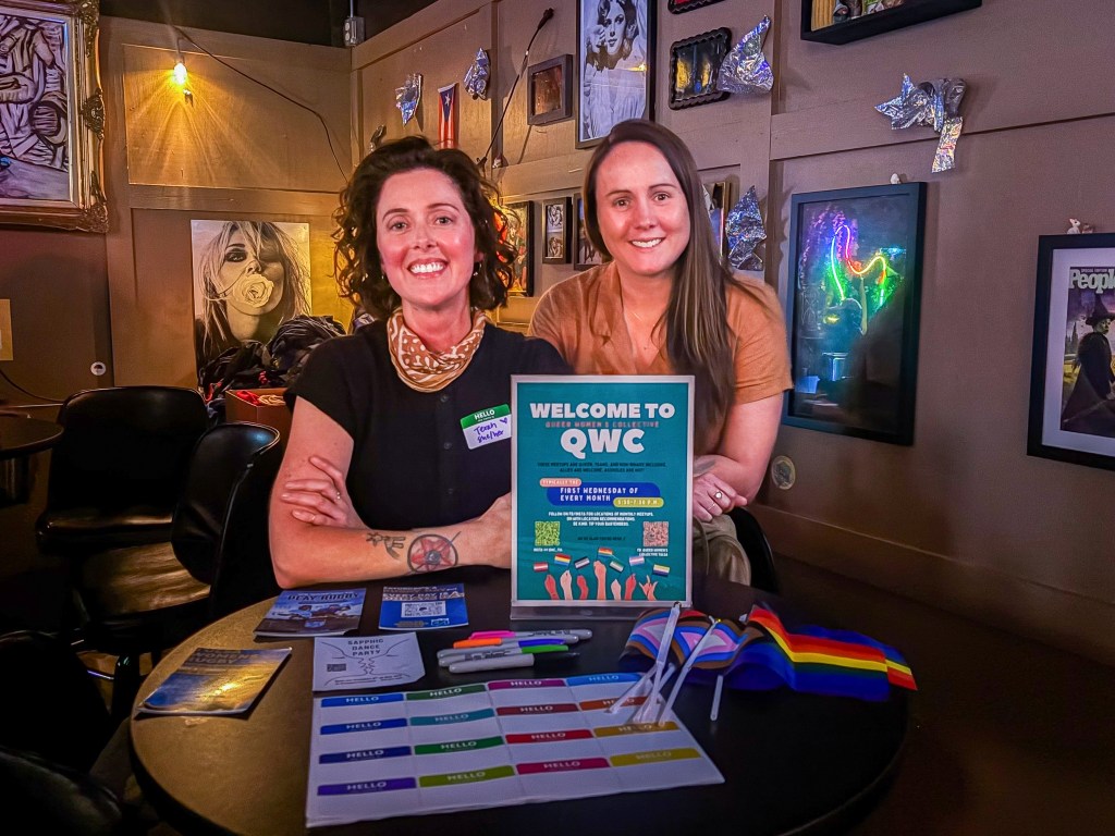 Queer Women's Collective co-founders Terah Williams and Hannah Jackson inside Yellow Brick Road Pub during a monthly meetup, Oct. 7, 2026.