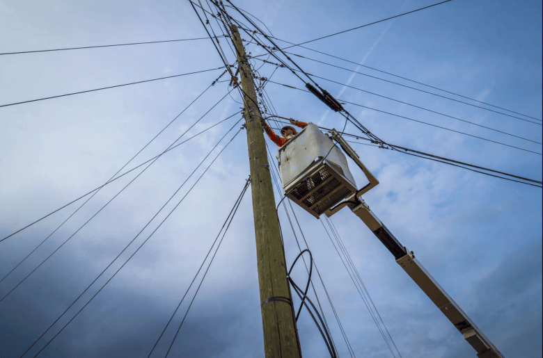 line worker installing cables