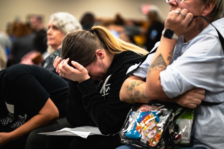 Attendees cry at the Tulsa Public Schools board meeting Monday, Oct. 19, 2026. The board voted 6-1 to approve a plan to close or consolidate 17 campuses.