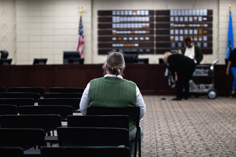 Gwendolyn Drumm, acting principal of Thoreau Demonstration Academy, takes a quiet moment at the Tulsa Public Schools board meeting Monday, Oct. 19, 2026. The board voted 6-1 to approve a plan to close or consolidate 17 campuses, including Thoreau.
